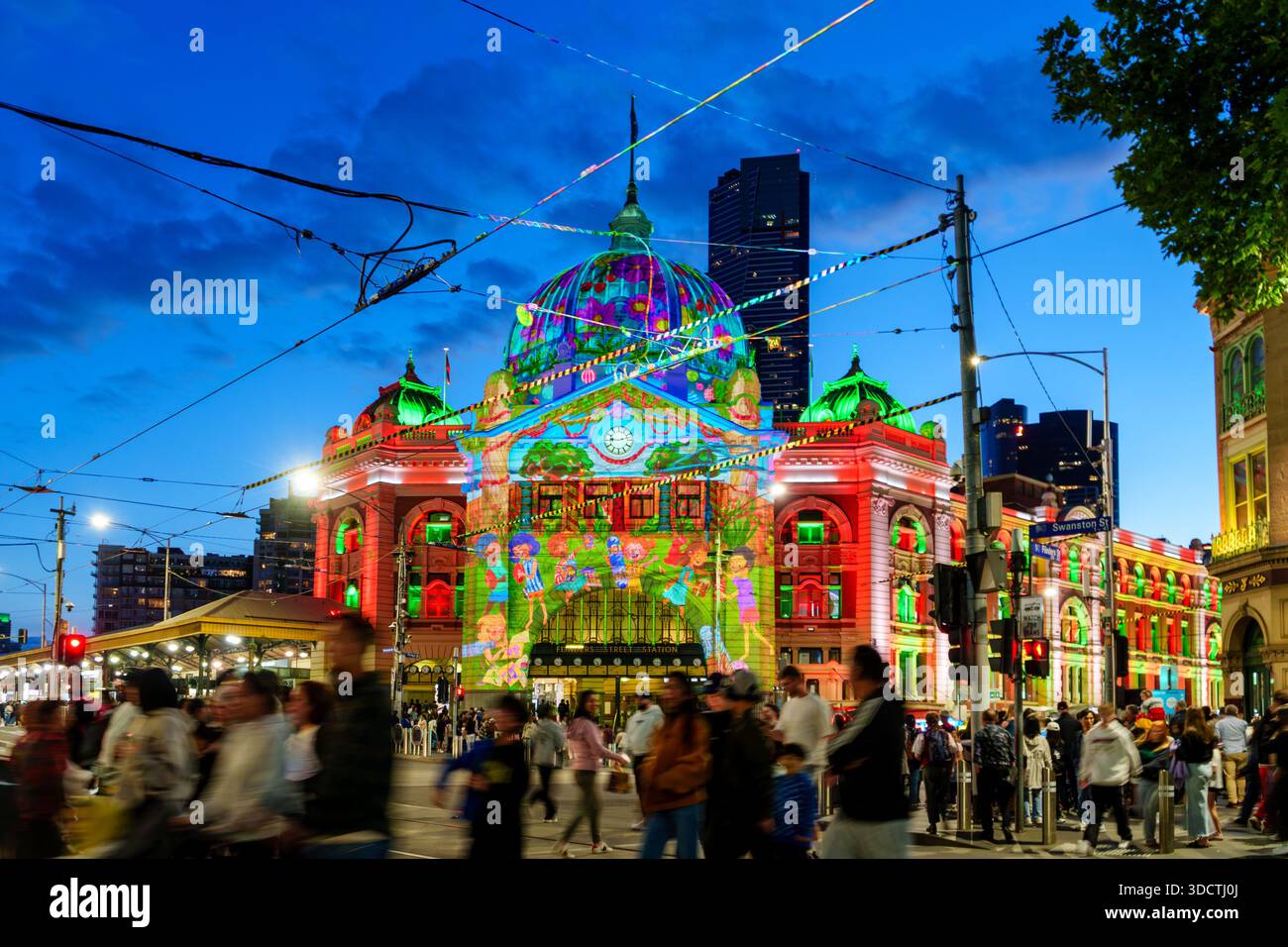 The iconic Flinders Street Station is illuminated by vibrant projection ...