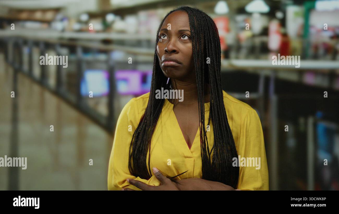 Woman braids stands in mall hi-res stock photography and images - Alamy