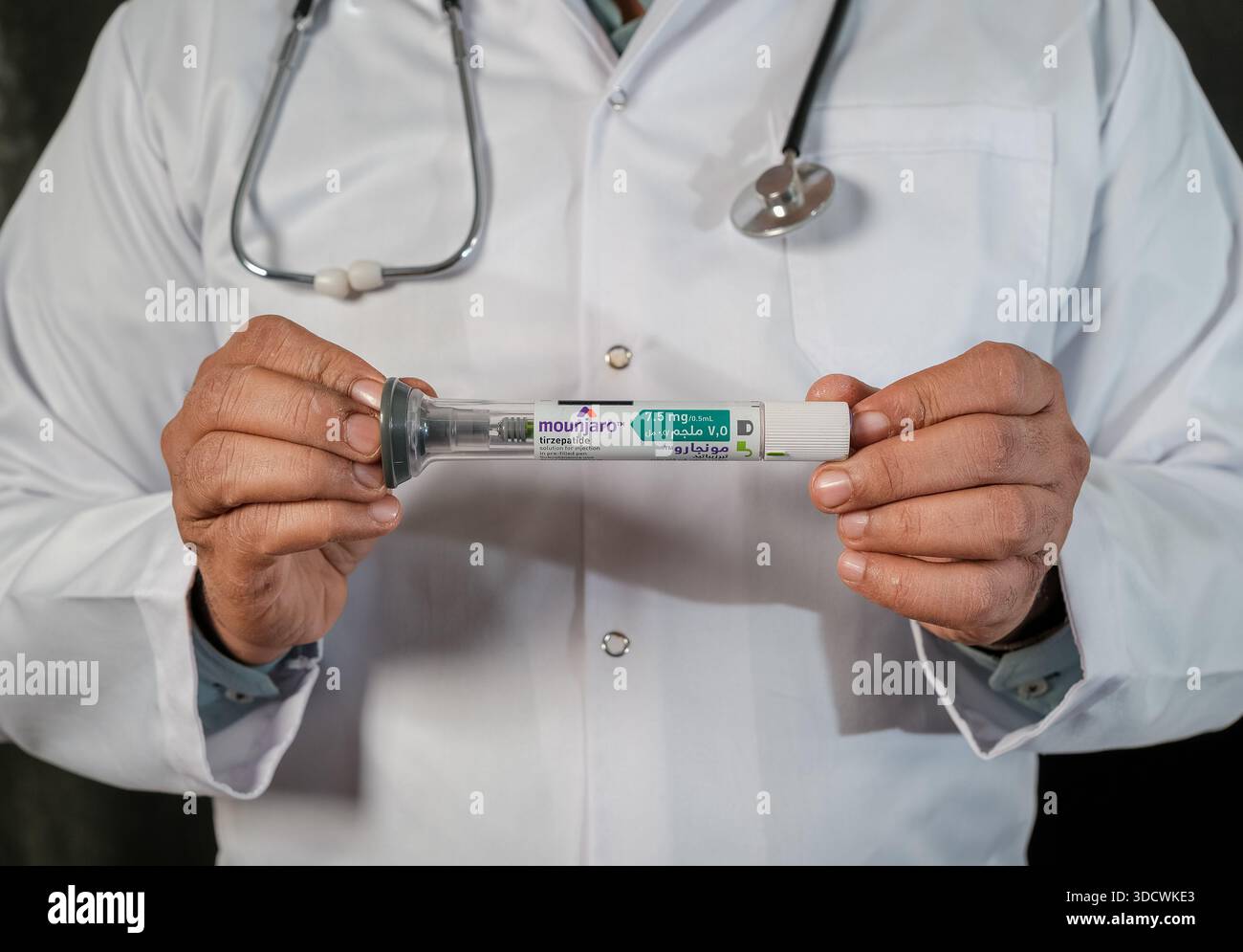 stock up on tirzepatide Medical doctor giving a thumbs up to successful Mounjaro tirzepatide weight  loss injection pen therapy Stock Photo
