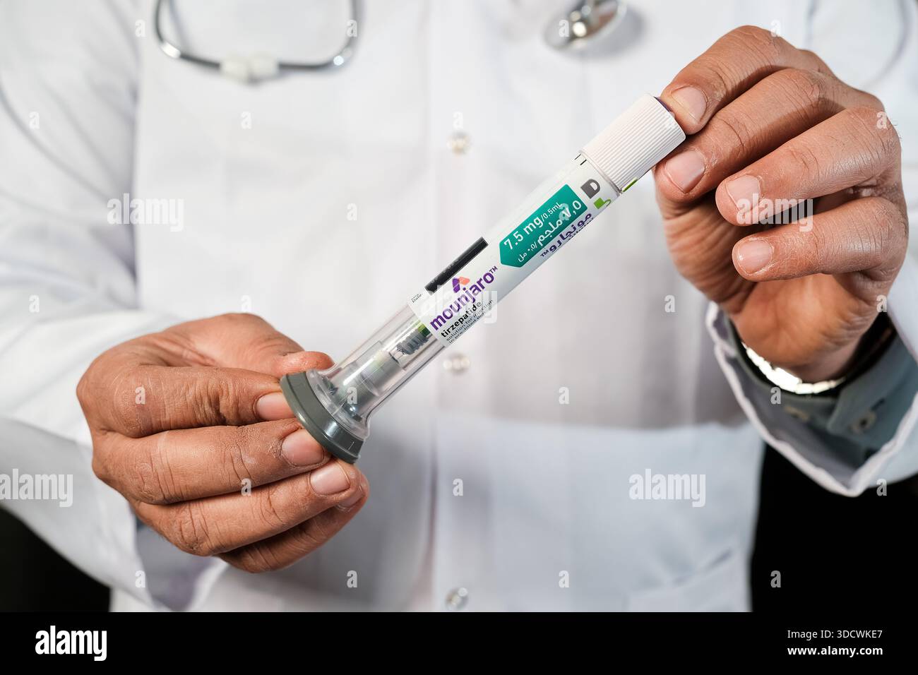 giving tirzepatide injection Medical doctor giving a thumbs up to successful Mounjaro tirzepatide weight  loss injection pen therapy Stock Photo