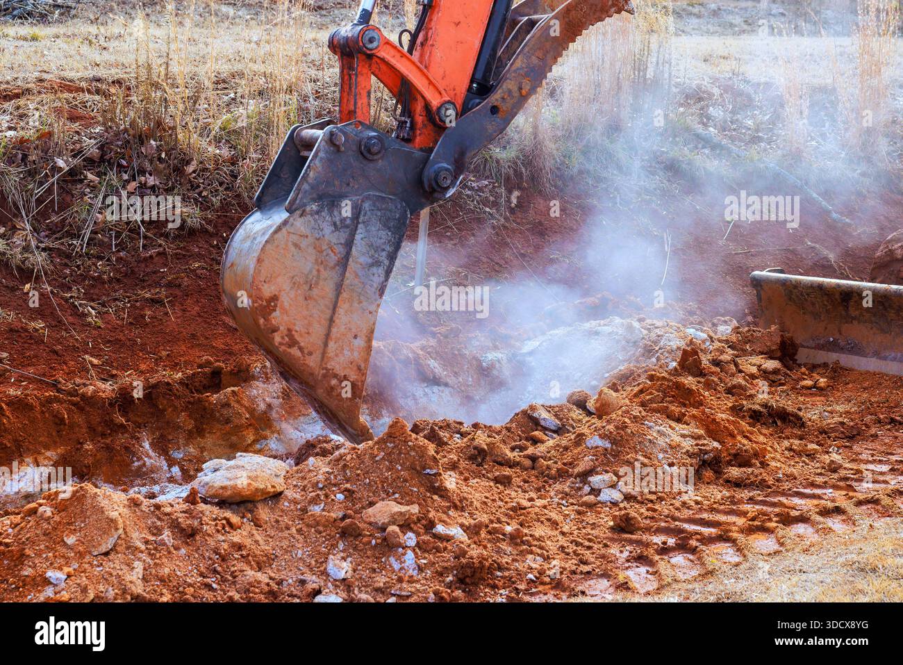 Dig Path Underground Excavator operates on dirt path, removing soil in ground during digging ...