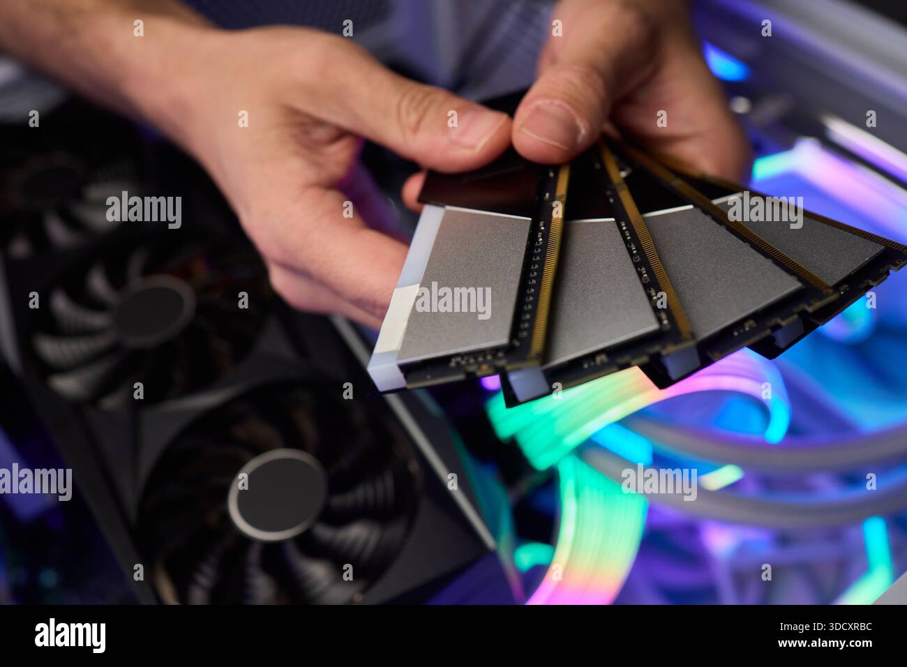 Computer hardware setup highlighting RAM sticks and graphics card details, Credentials for professional technical environment featuring RAM modules Stock Photo
