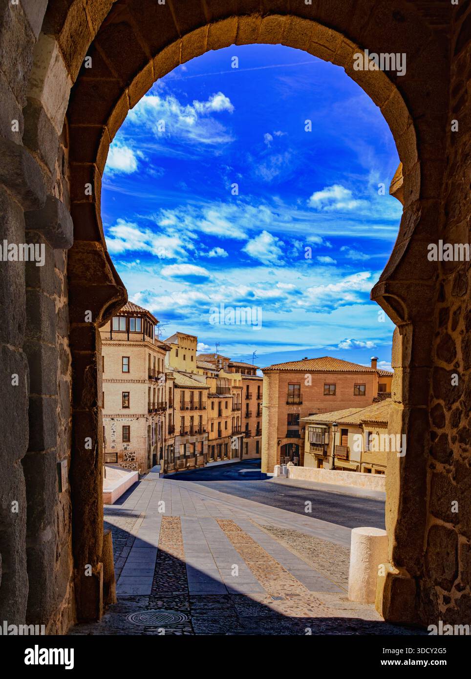 The old town of Toledo, where narrow streets and imposing architecture prevail, is located on the right bank of the Tagus River on a hill surrounded b Stock Photo