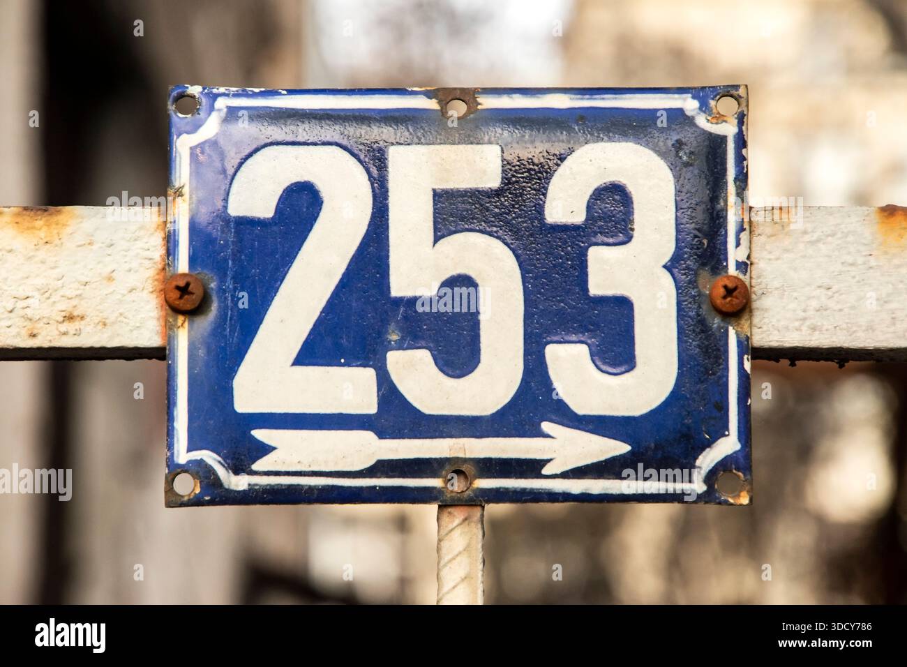 Old enamel house number 253 on metal gate, evoking nostalgia, time ...