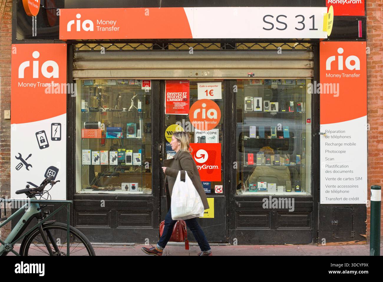 France, Toulouse, 2025-03-19. Window display at a Ria store in Toulouse, specializing in fast, secure international money transfers Stock Photo