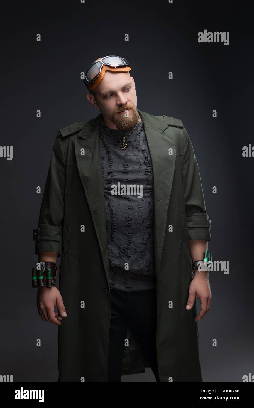 Charismatic bald man in cyberpunk raincoat with distressed fabric