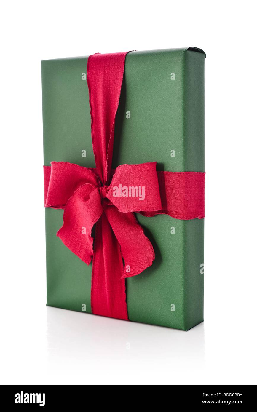 Green gift box with red bow isolated on white background, clipping path included Stock Photo