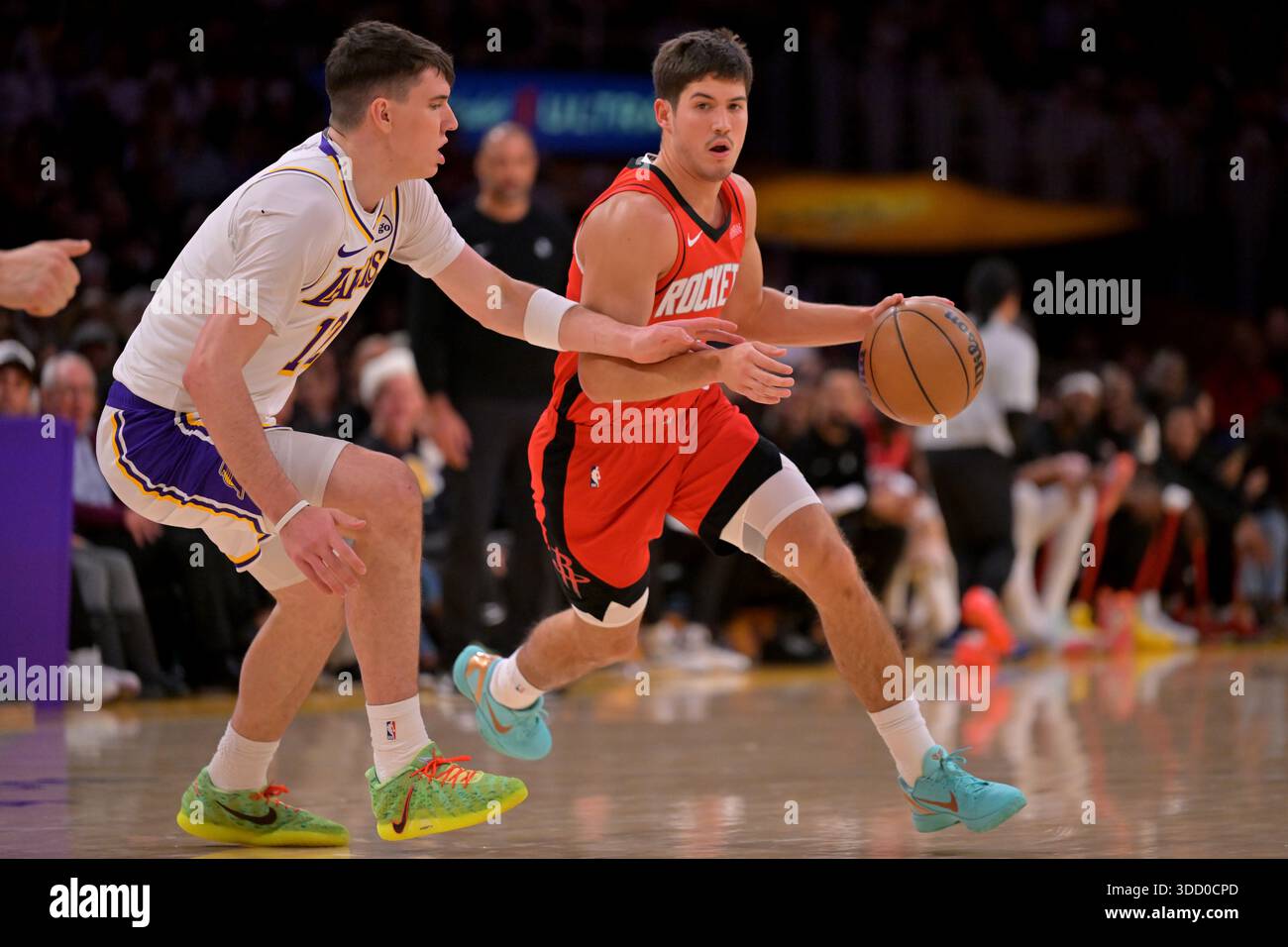 Los Angeles Lakers forward Jake Laravia, left, guards Houston Rockets ...