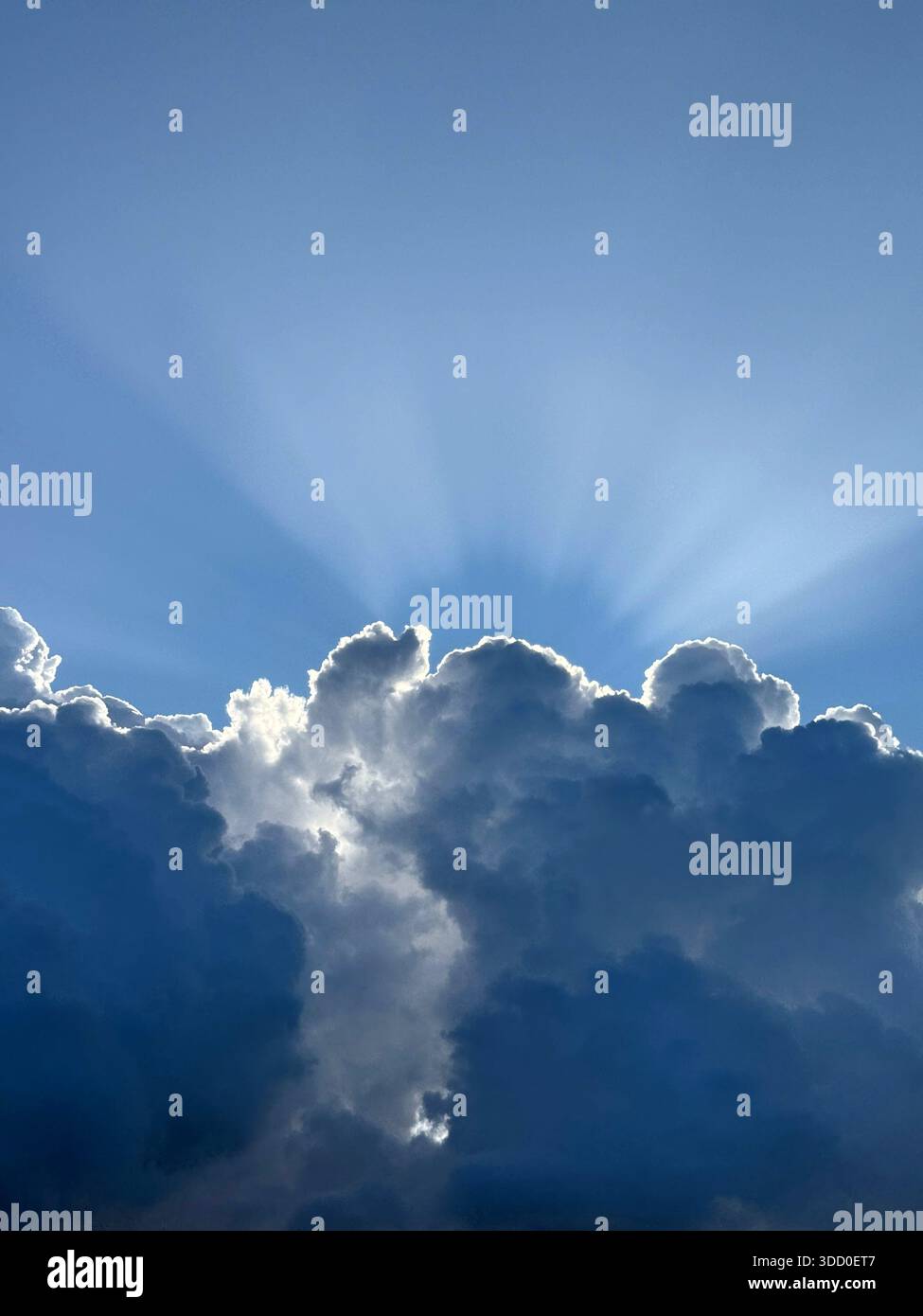 Dramatic sky storm cloud with sun rays Stock Photo
