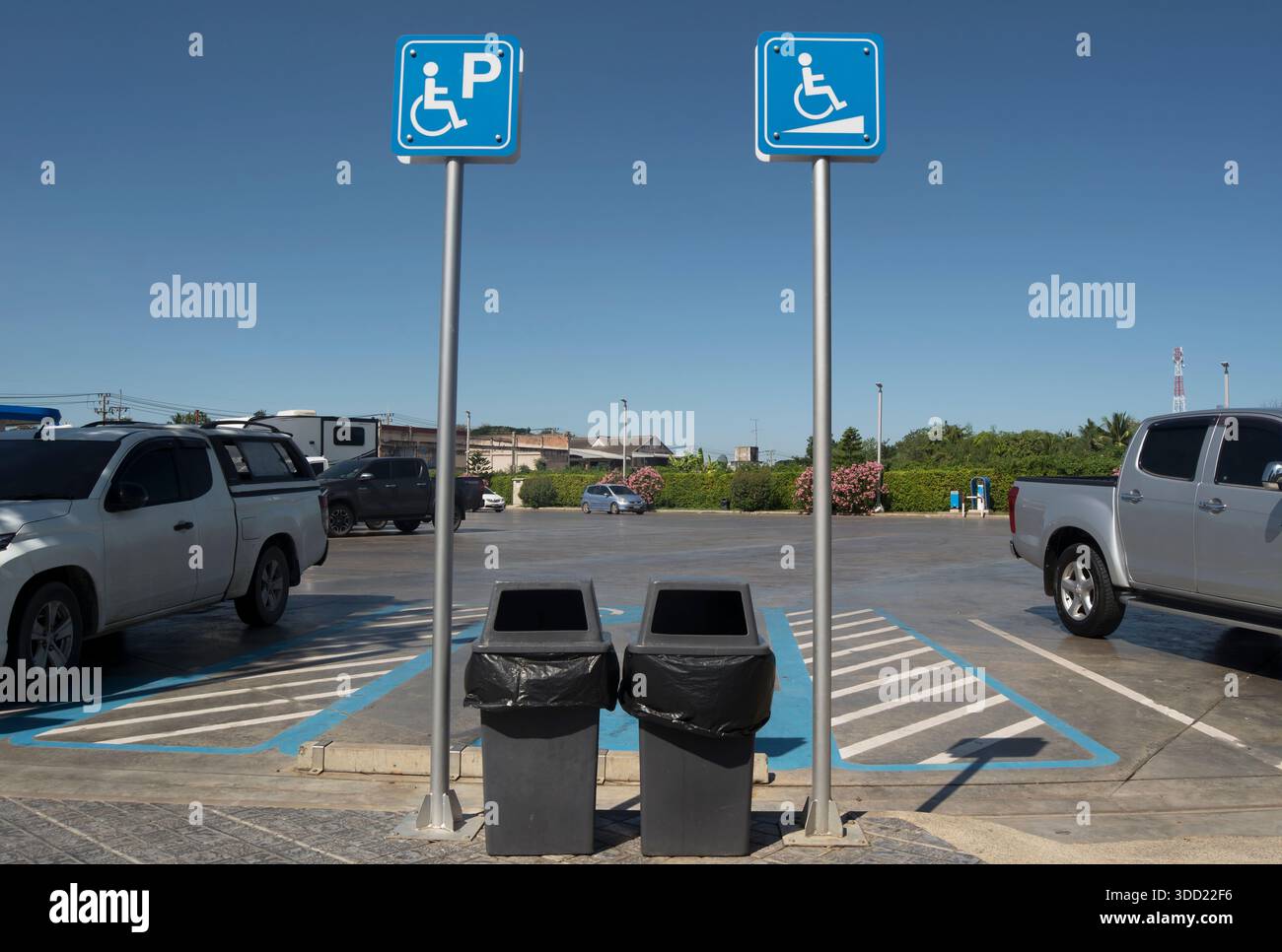 Iriguchi Sign Ramp disabled parking signs, one indicating a ramp for wheelchair users, at ...