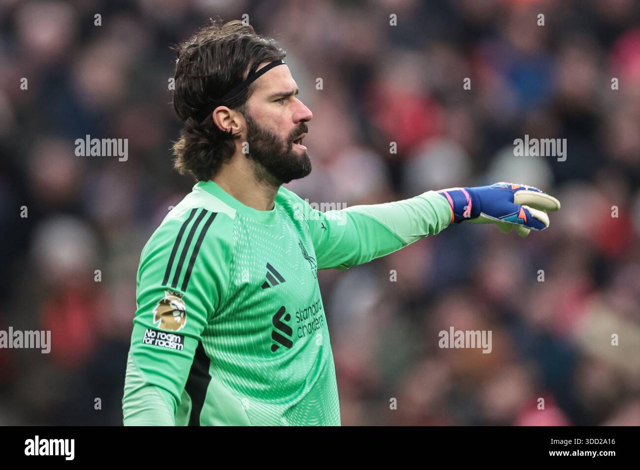 Alisson Becker of Liverpool gives his team instructions during the ...