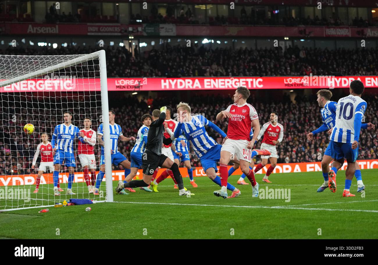 Brighton's Georginio Rutter, right, scores an own goal during the ...