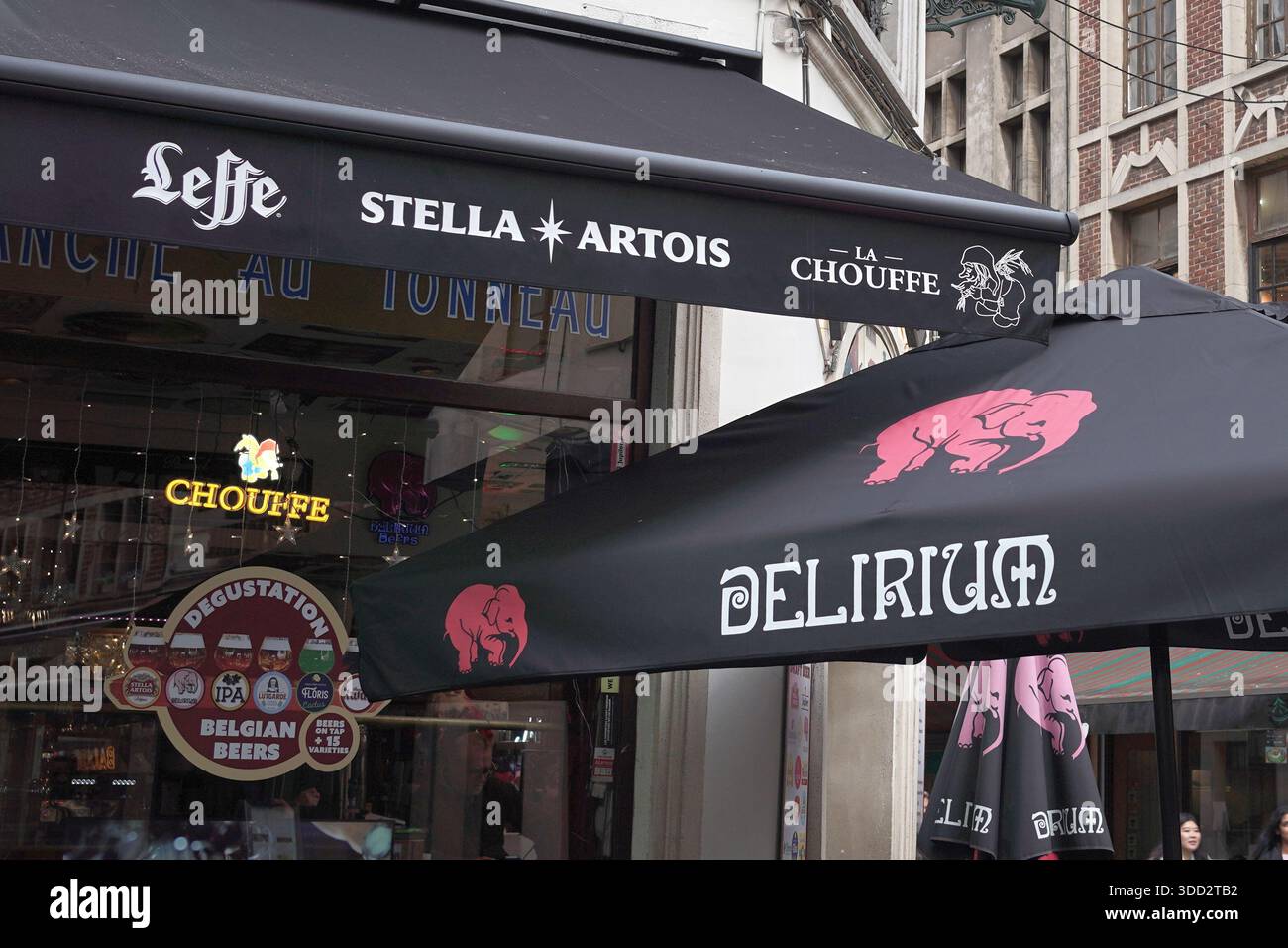 Belgium Beer brands advertised on a bar umbrella in Brussels, Belgium Stock Photo