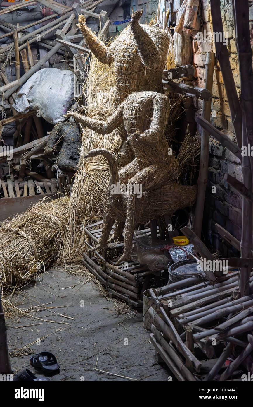 Straw statues ready to be covered in clay for Hindu festivals Stock Photo