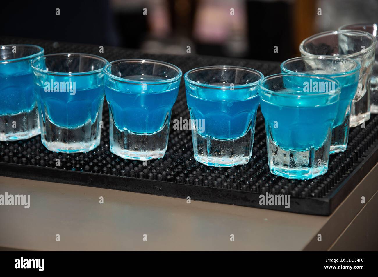 several shots of a Blue Kamikaze cocktail. This drink is a variation of ...