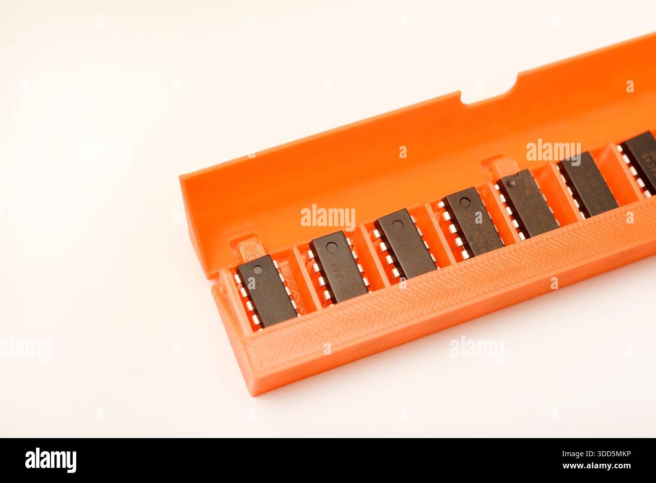 Microchips in a plastic case. Integrated circuits in a plastic storage case. Electronic chips. Stock Photo