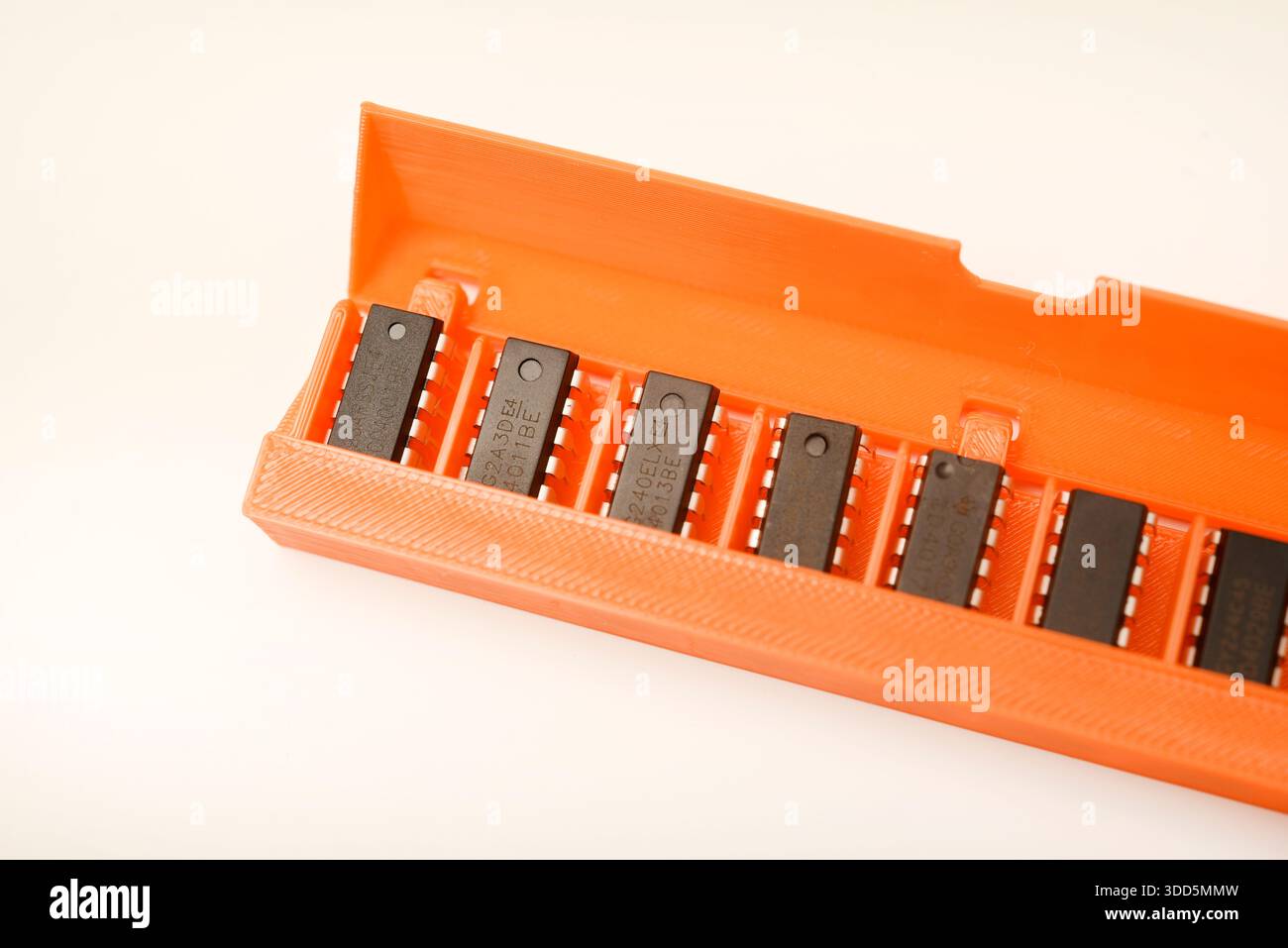 Microchips in a plastic case. Integrated circuits in a plastic storage case. Electronic chips. Stock Photo