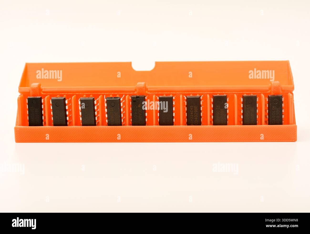 Microchips in a plastic case. Integrated circuits in a plastic storage case. Electronic chips. Stock Photo