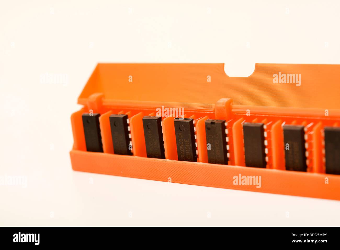Microchips in a plastic case. Integrated circuits in a plastic storage case. Electronic chips. Stock Photo
