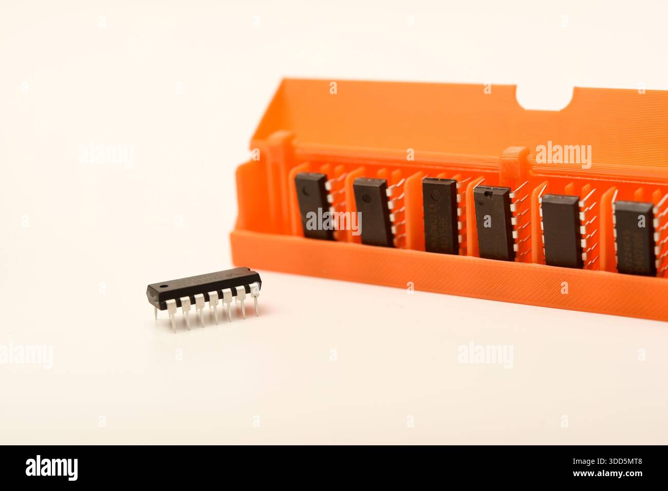 Microchips in a plastic case. Integrated circuits in a plastic storage case. Electronic chips. Stock Photo