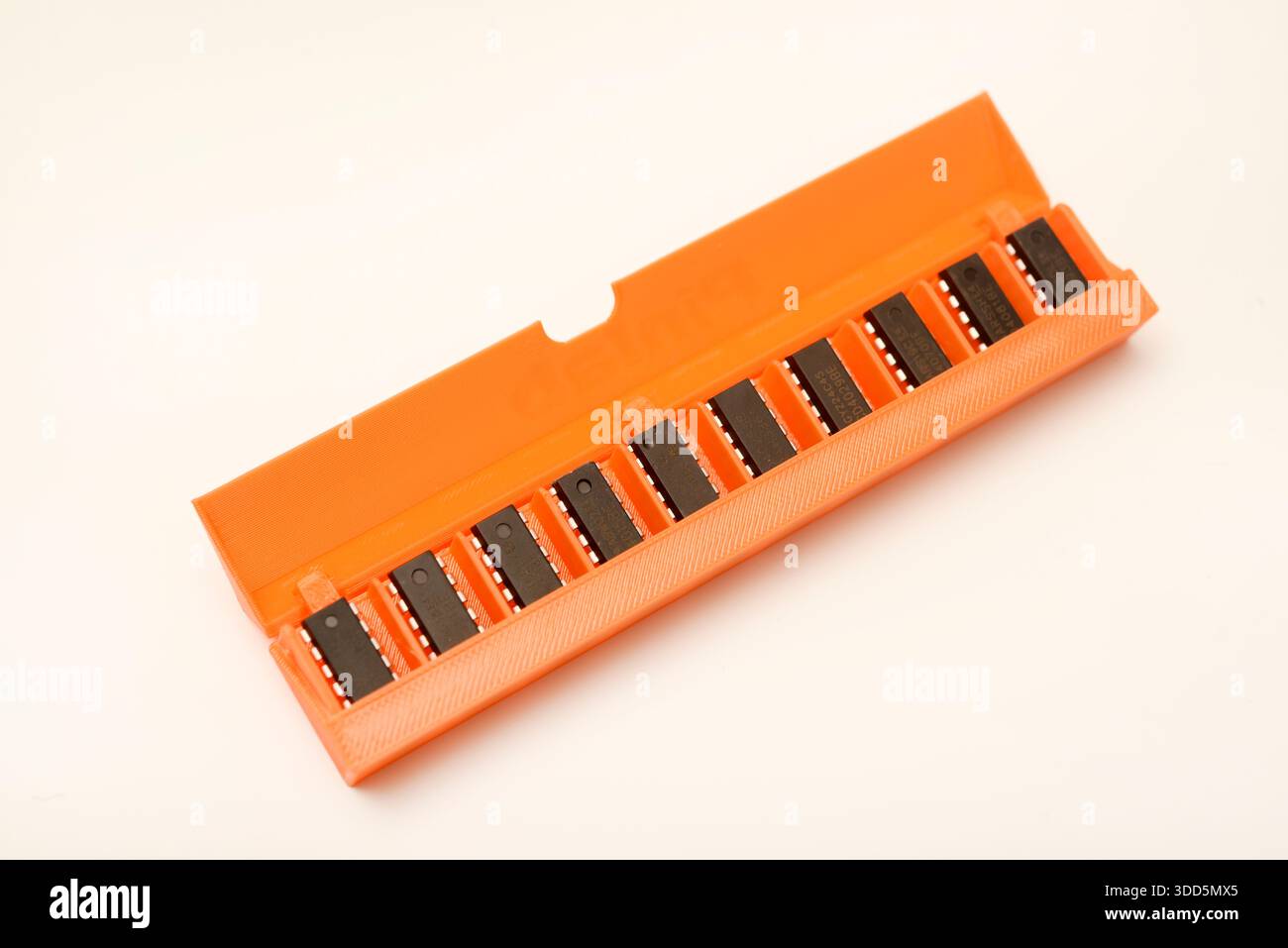 Microchips in a plastic case. Integrated circuits in a plastic storage case. Electronic chips. Stock Photo