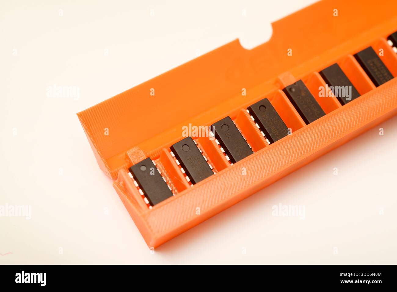 Microchips in a plastic case. Integrated circuits in a plastic storage case. Electronic chips. Stock Photo