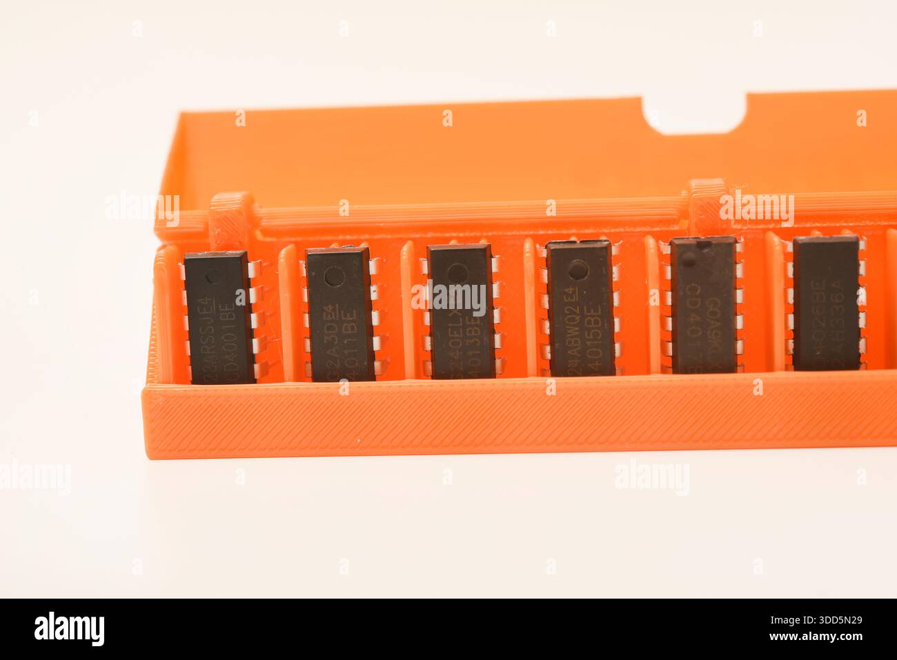 Microchips in a plastic case. Integrated circuits in a plastic storage case. Electronic chips. Stock Photo