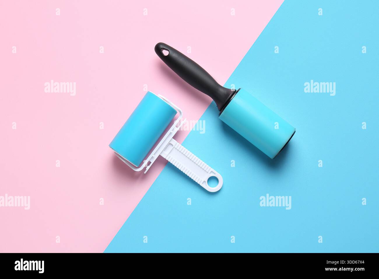 Different lint rollers on color background Stock Photo