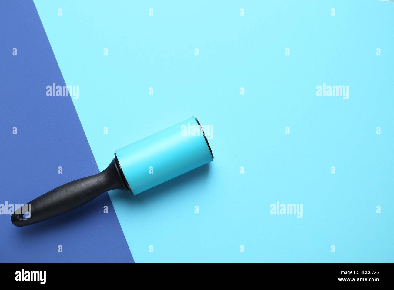 Lint roller on color background Stock Photo