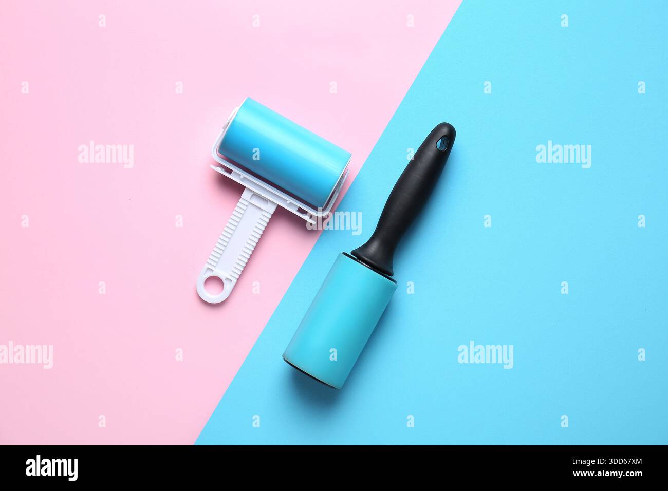 Different lint rollers on color background Stock Photo