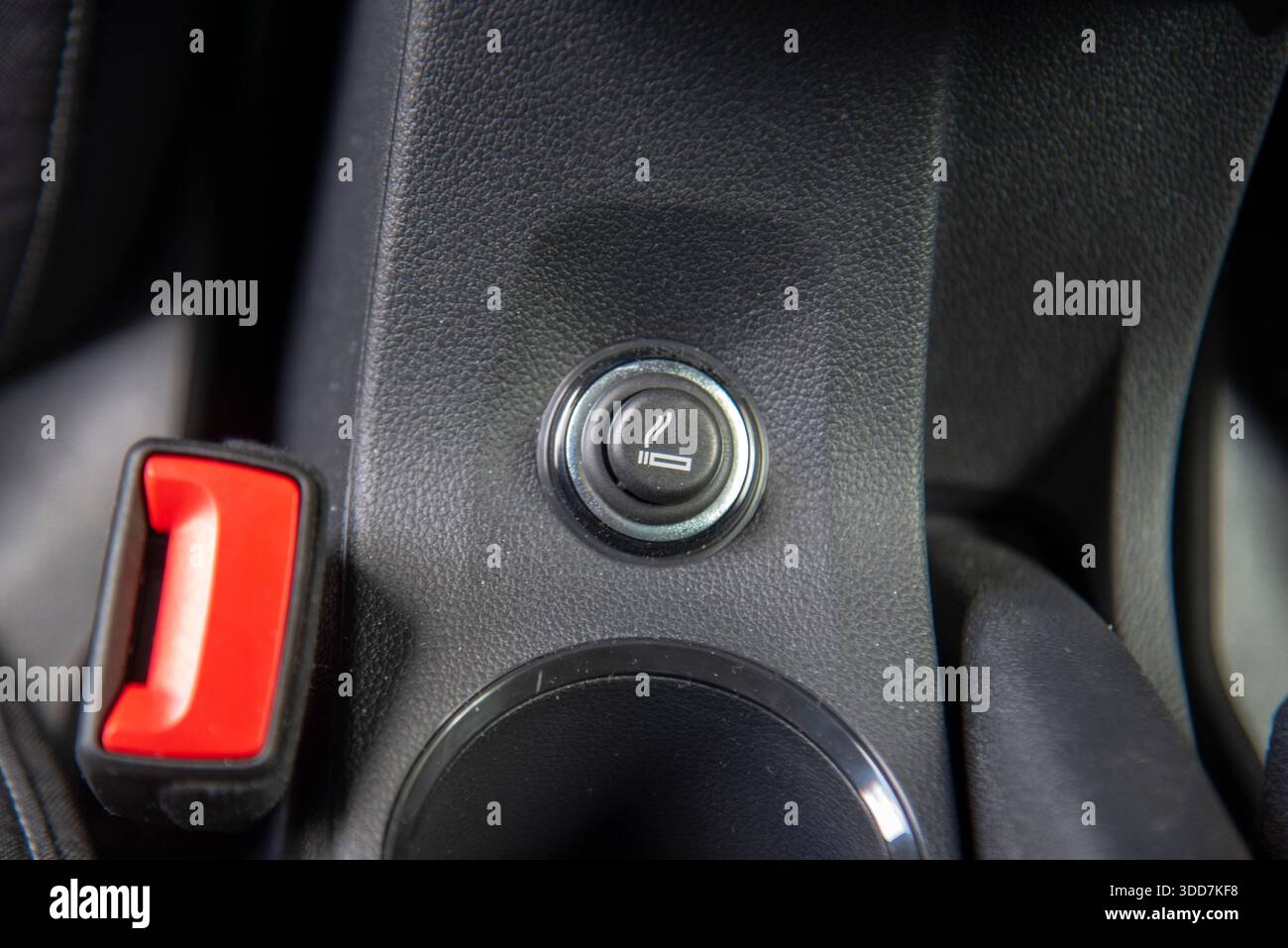 Car cigarette lighter. Cigarette lighter on the dashboard of a passenger car  Stock Photo