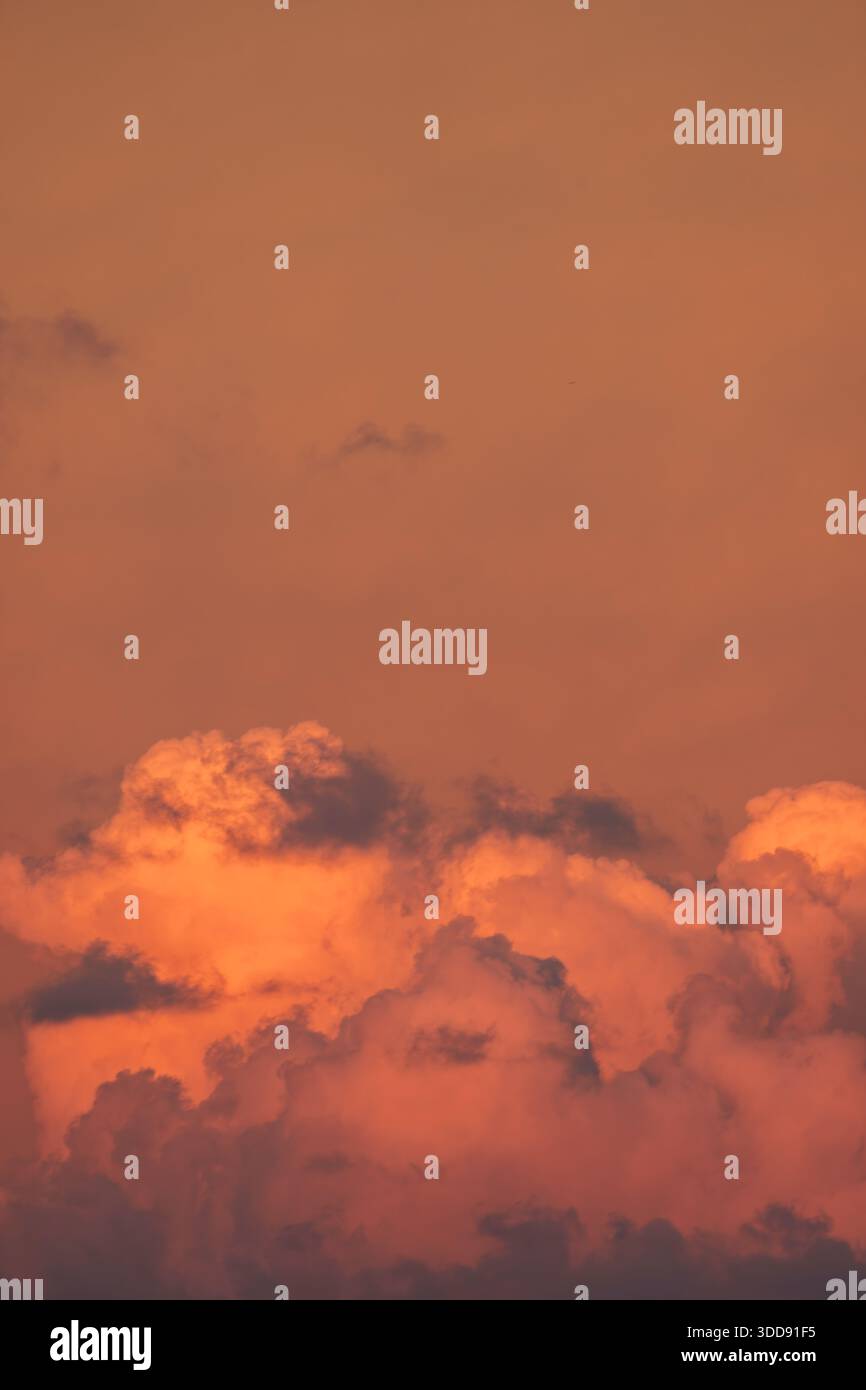 Dramatic red evening sky with low-level deep red stratocumulus cloud formation and sky. Stock Photo