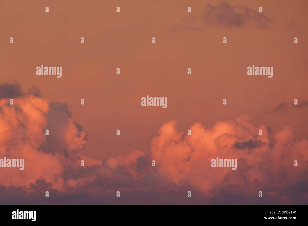 Dramatic red evening sky with low-level deep red stratocumulus cloud formation and sky. Stock Photo