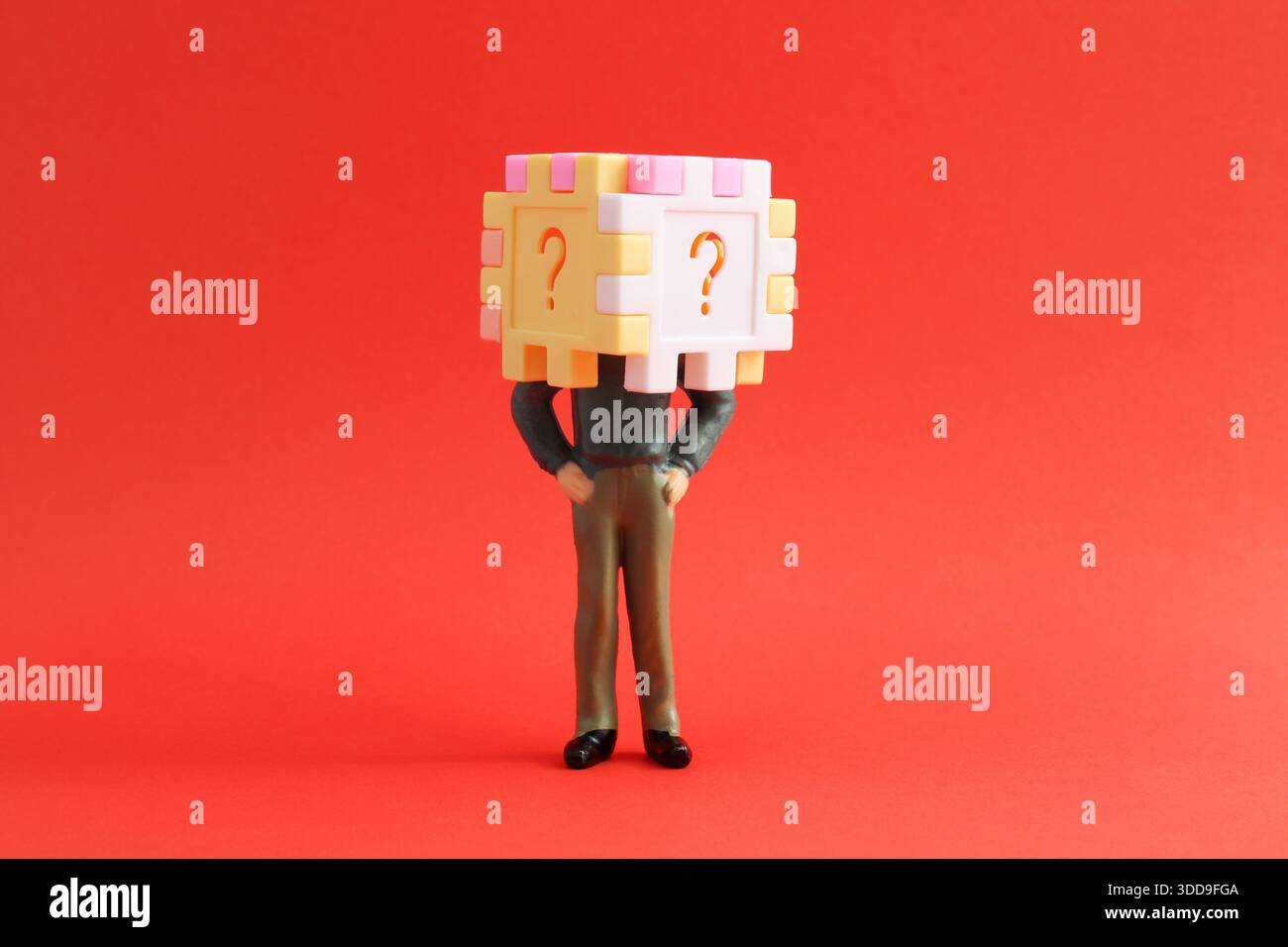 Cube with question marks on an executive's head Stock Photo