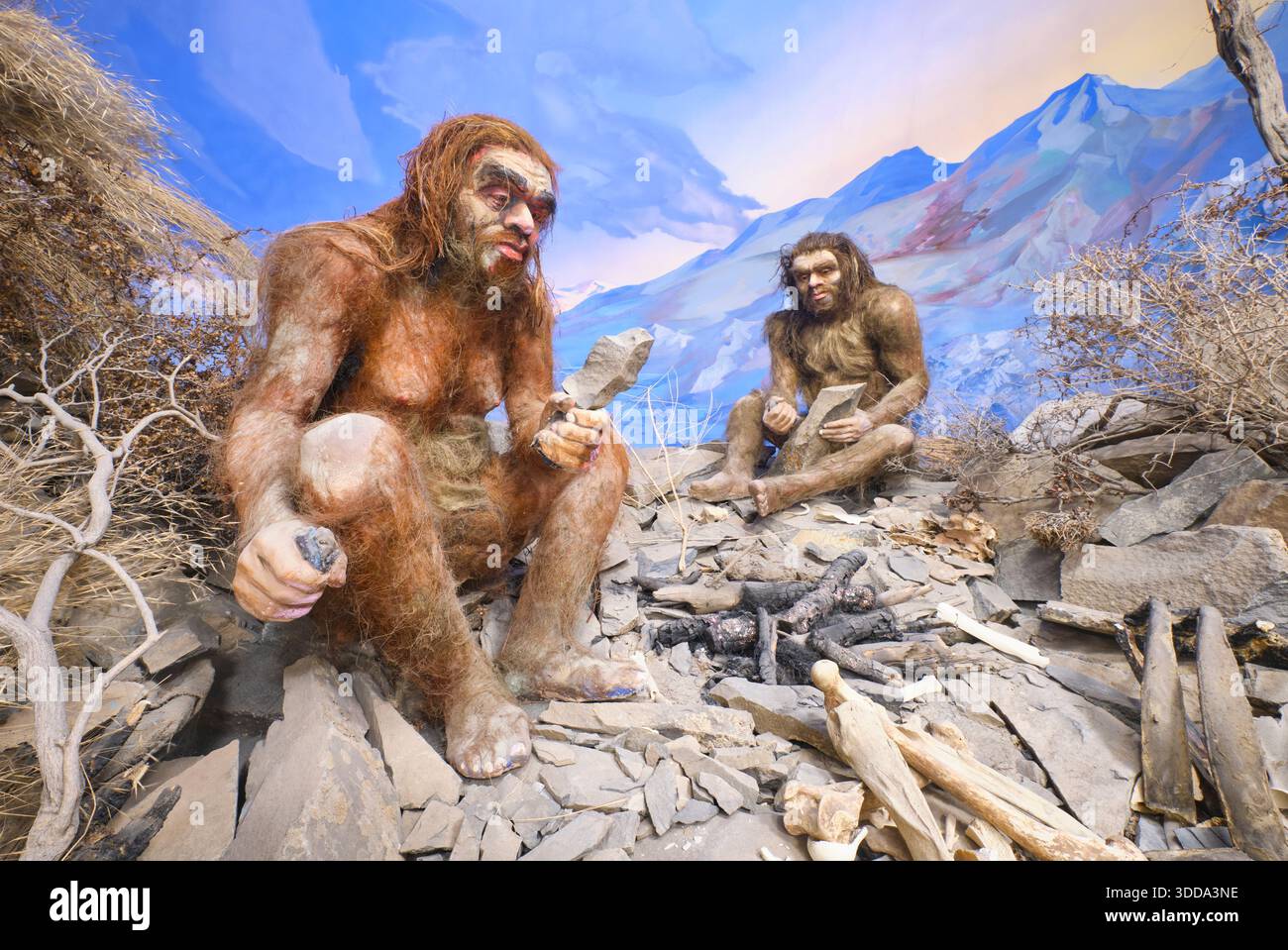 Stone age, cave man era group on rocks. A diorama at the Fergana