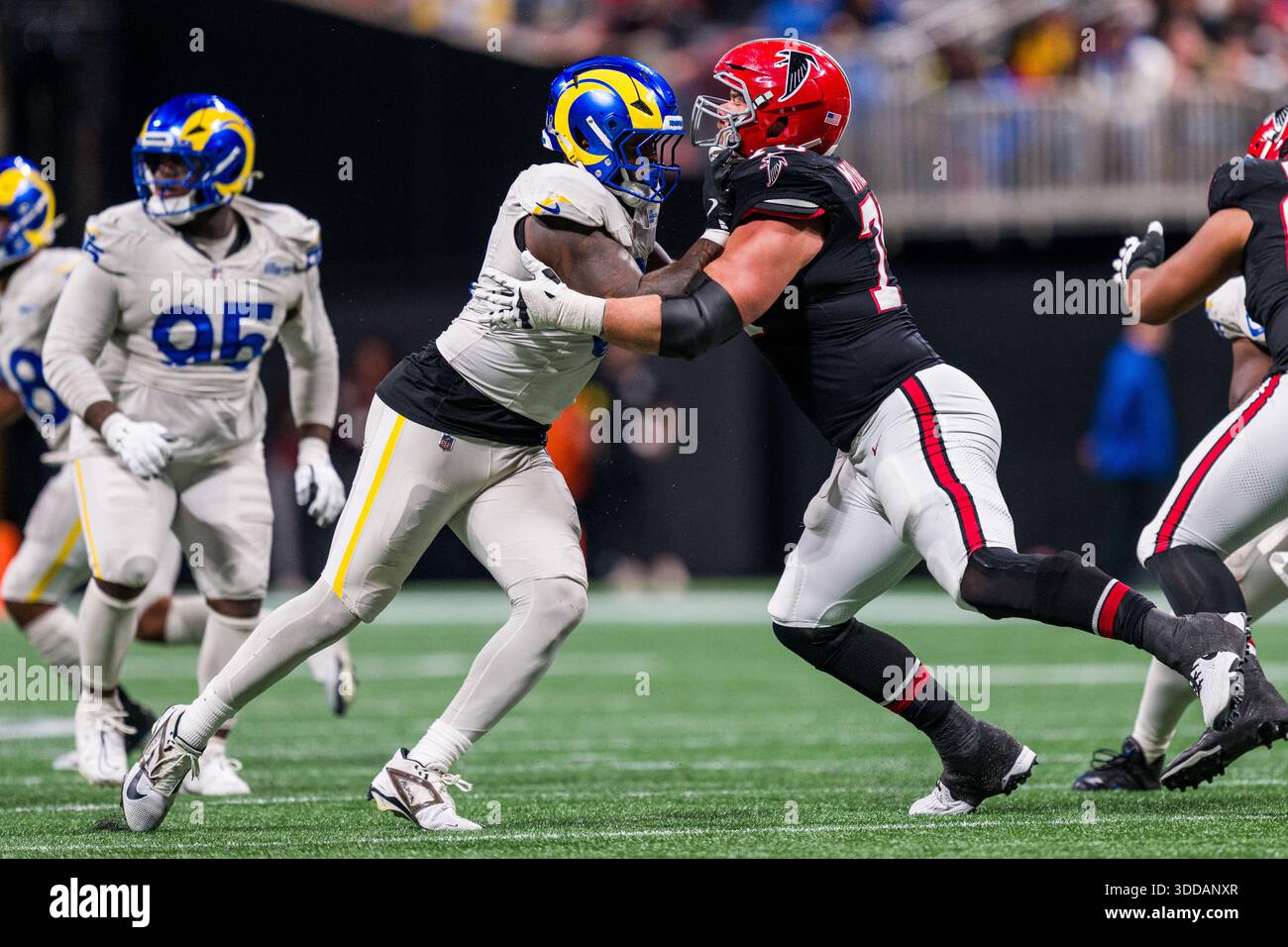 Los Angeles Rams linebacker Jared Verse (8) works against Atlanta ...