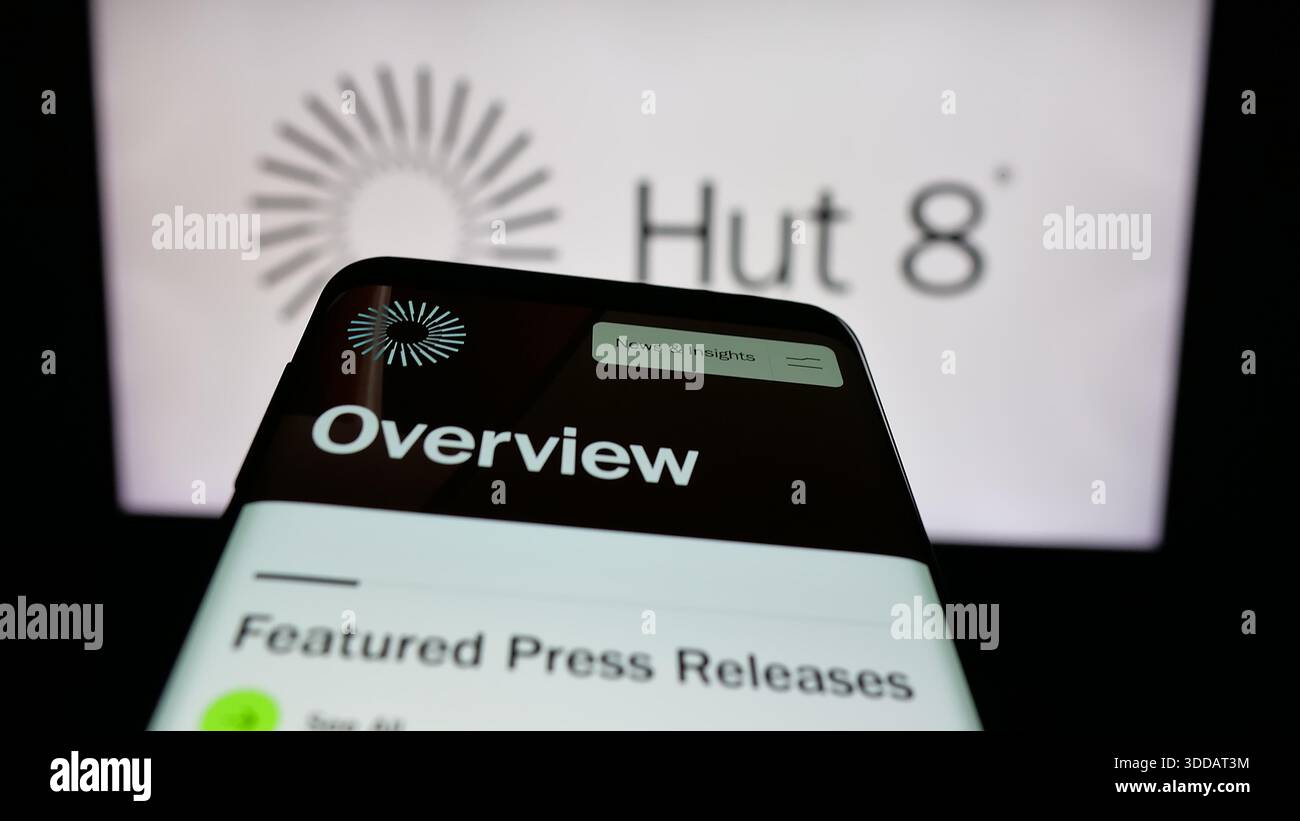 Stuttgart, Germany - 12-17-2025: Mobile phone with website of US crypto  mining company Hut 8 Corp. on screen in front of logo Stock Photo - Alamy