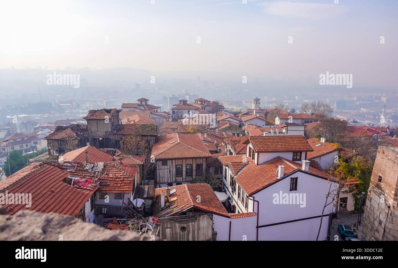 The cityscape of Ankara, Türkiye under smog seen from Ankara Castle - Stock Image