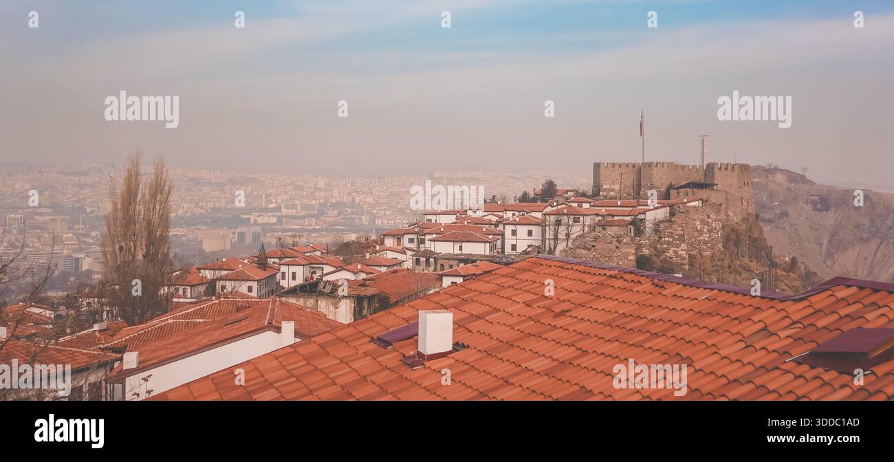 The cityscape of Ankara, Türkiye under smog seen from Ankara Castle - Stock Image