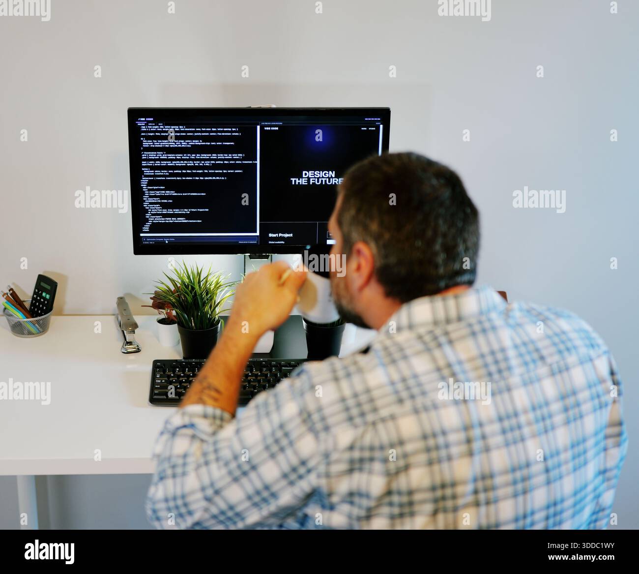 Middle Aged Software Engineer Vibe Codes Landing Page for Artificial Intelligence Based Integrated Development Environment Application Concept Stock Photo