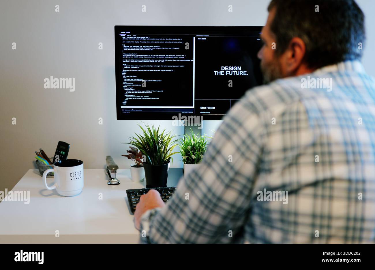 Middle Aged Software Engineer Vibe Codes Landing Page for Artificial Intelligence Based Integrated Development Environment Application Concept Stock Photo