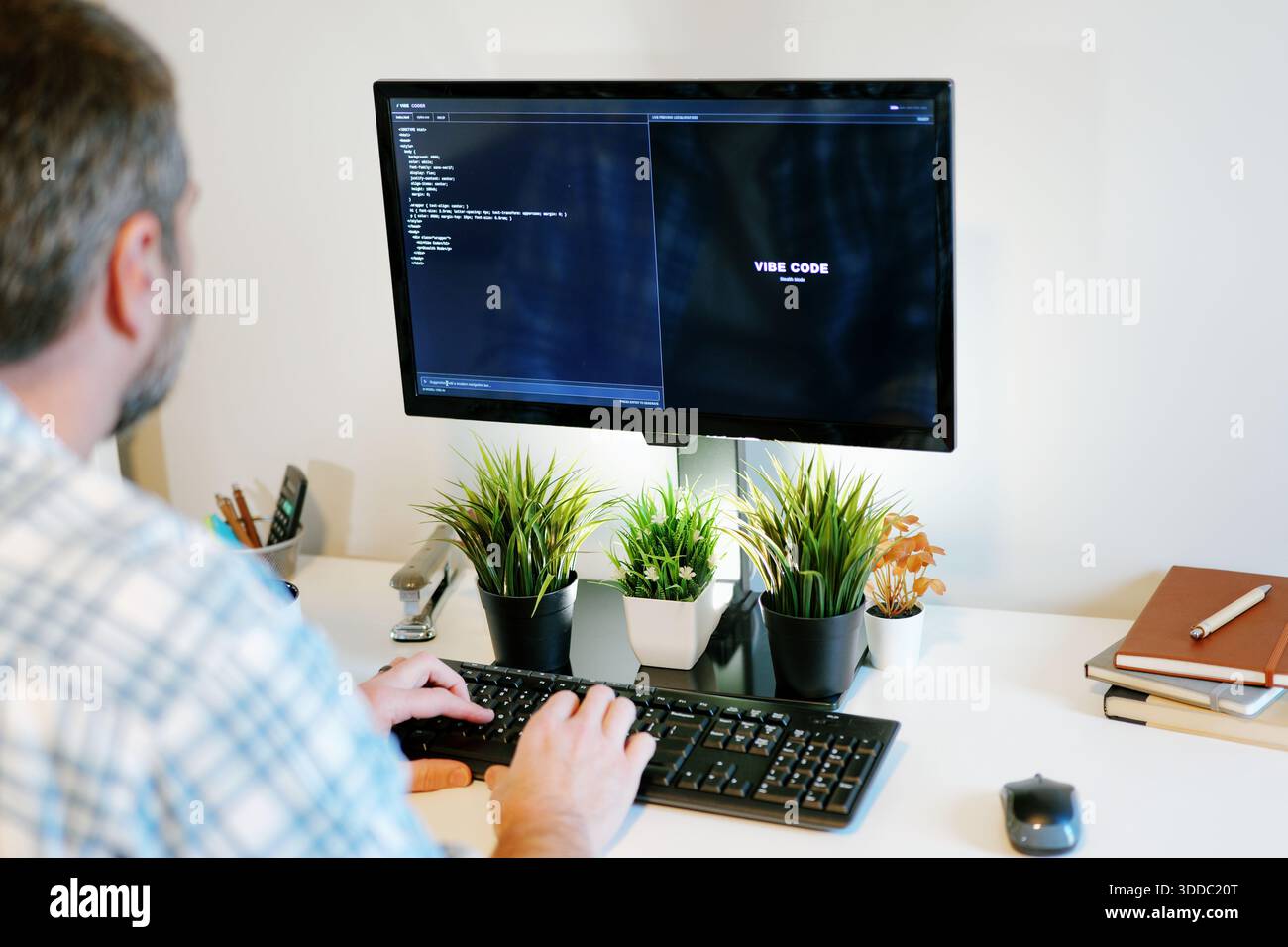 Middle Aged Software Engineer Vibe Codes Landing Page for Artificial Intelligence Based Integrated Development Environment Application Concept Stock Photo