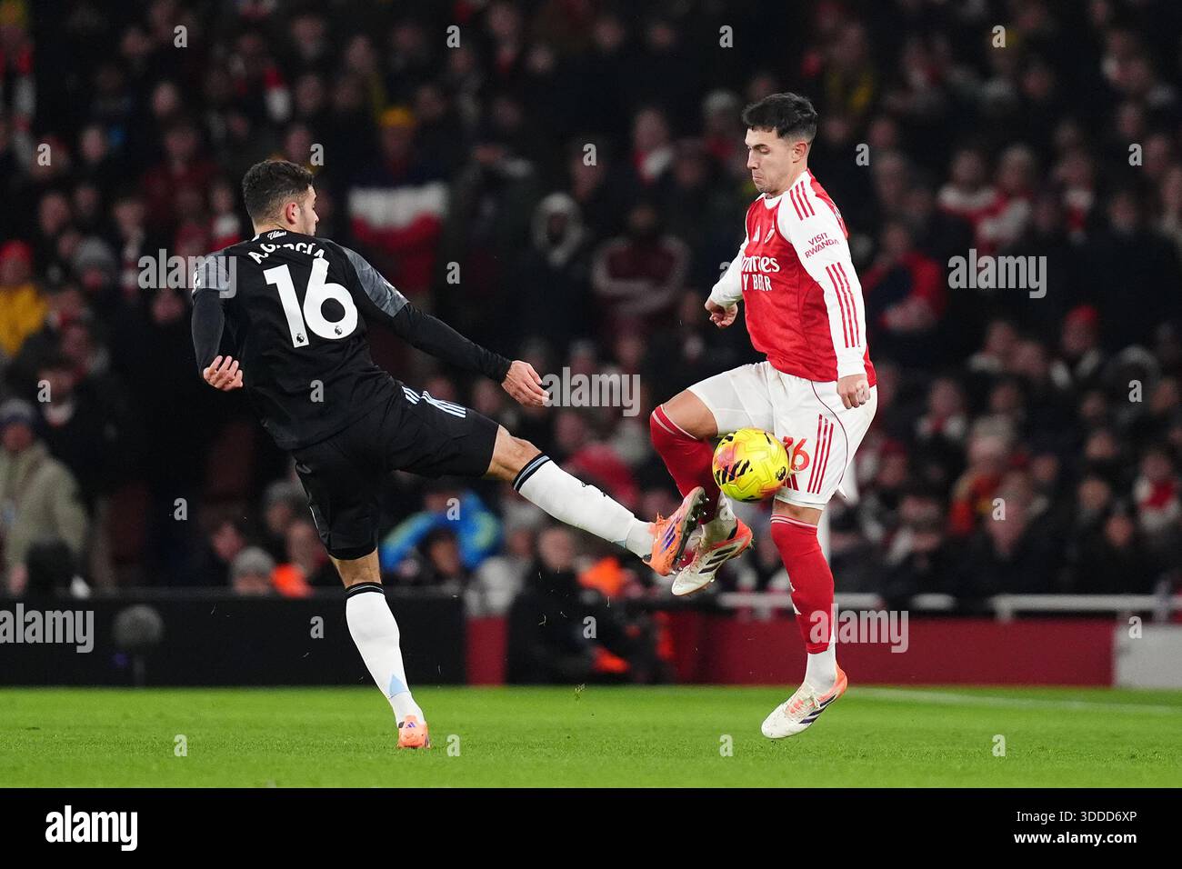 Aston Villa's Andres Garcia (left) and Arsenal's Martin Zubimendi battle for the ball during the Premier League match at the Emirates Stadium, London. Picture date: Tuesday December 30, 2025. Stock Photo