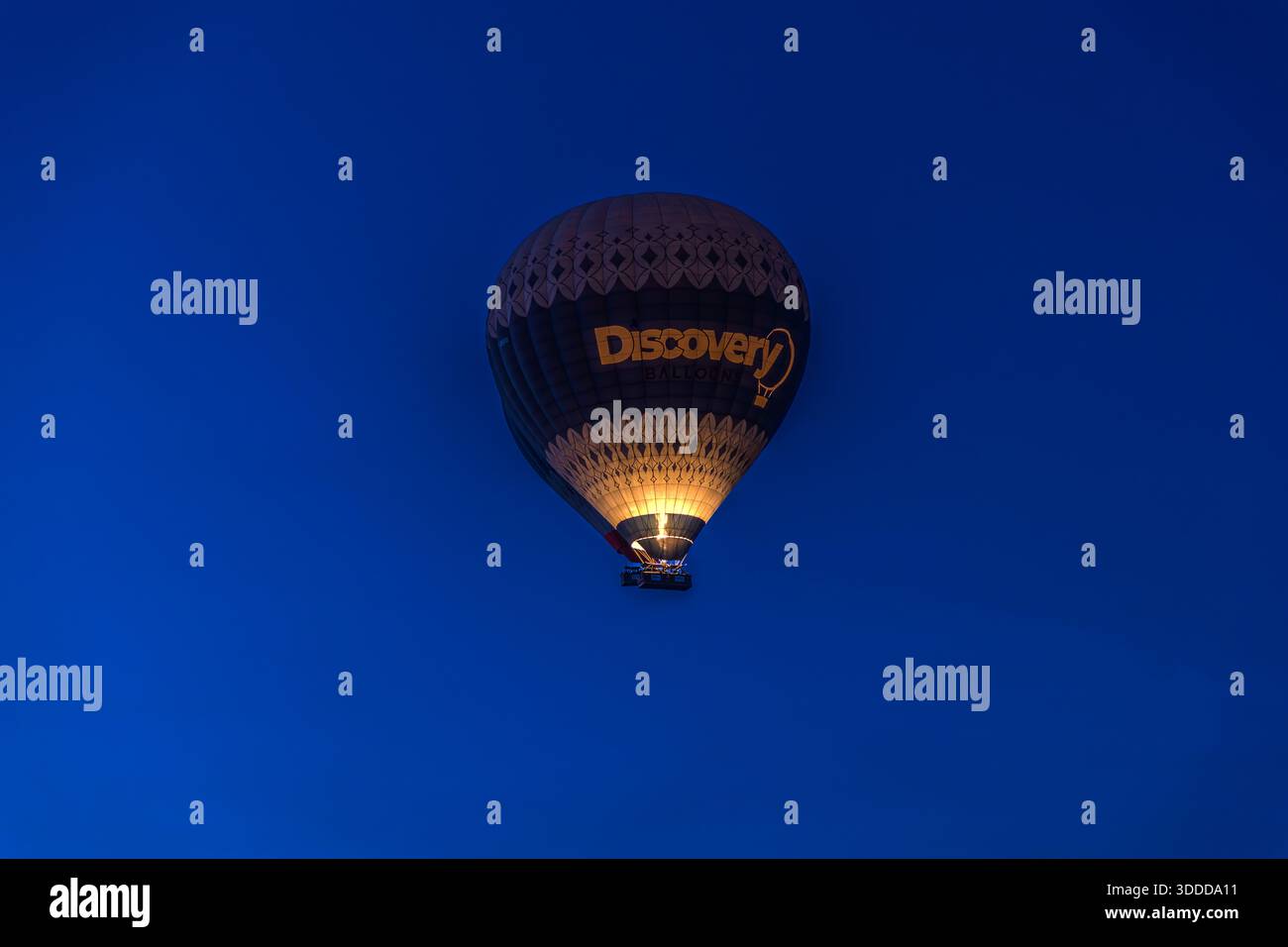 Discovery Balloons hot air balloon flies at sunrise in Göreme, Central Anatolia Region, Turkey Stock Photo