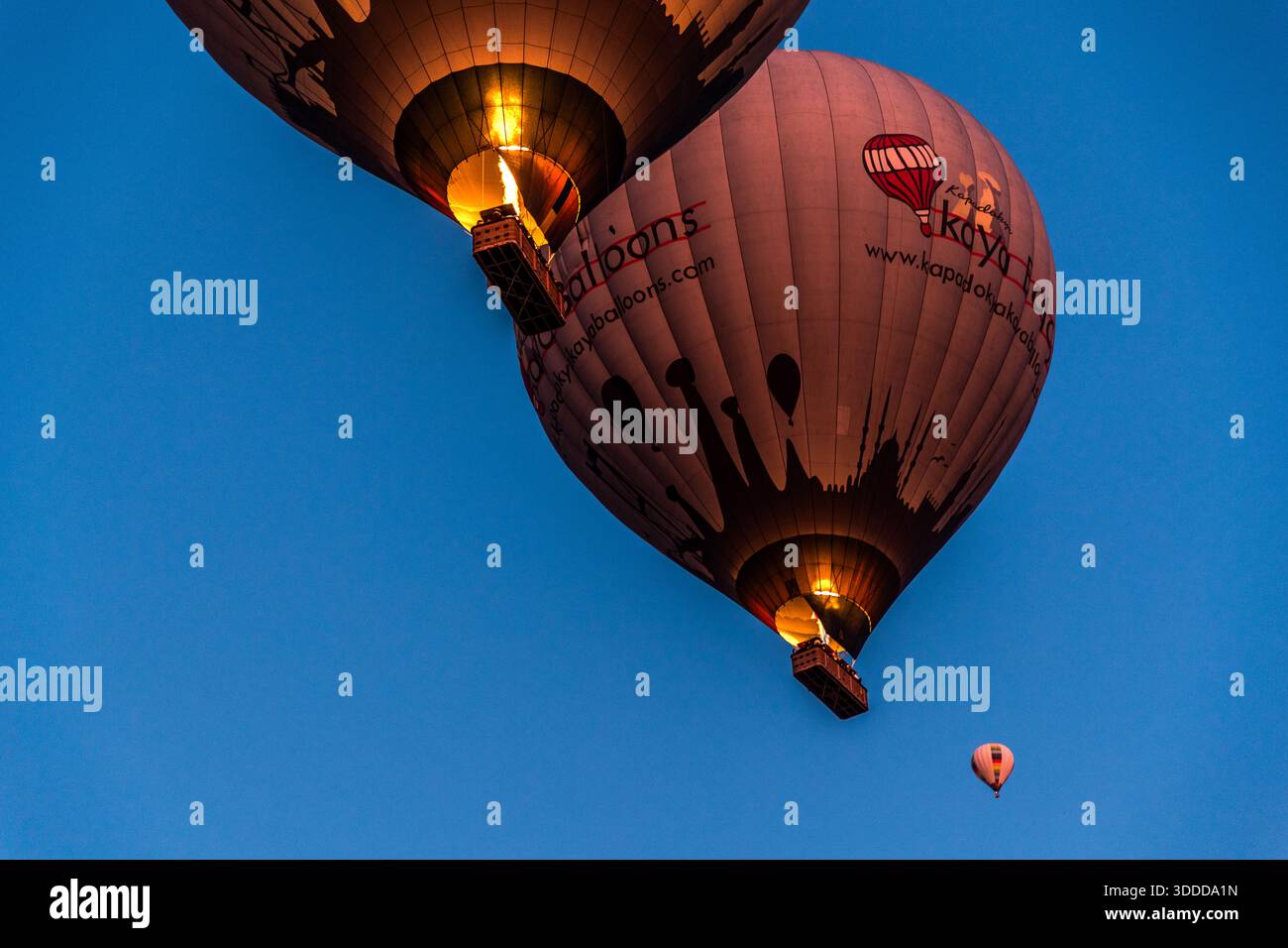 Hot air balloons take off at sunrise in Göreme, Central Anatolia Region, Turkey Stock Photo