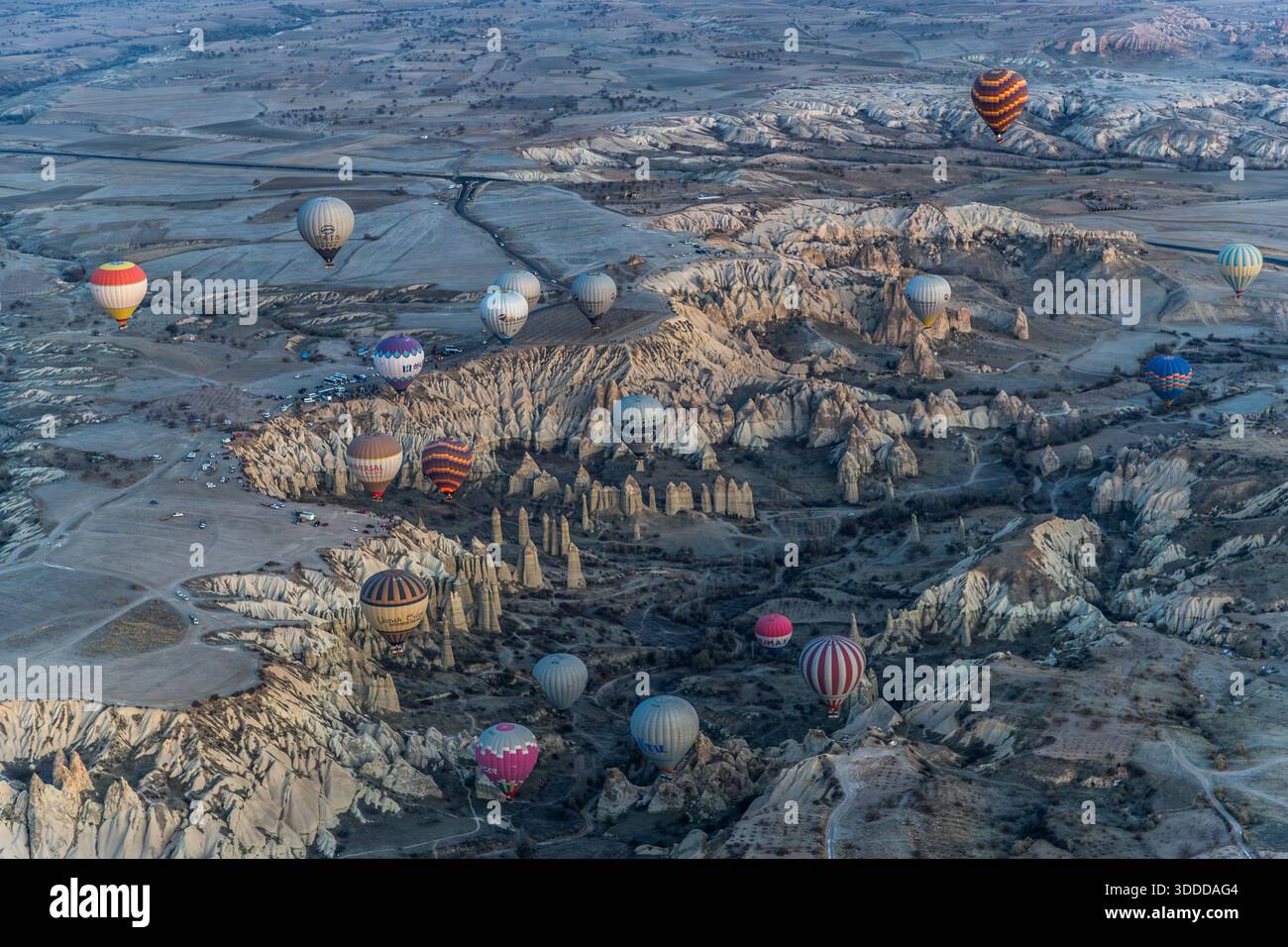 Hot air balloons float above the unique landscape of Göreme, Central Anatolia Region, Turkey. Tuff stone landscape and fairy chimneys Stock Photo