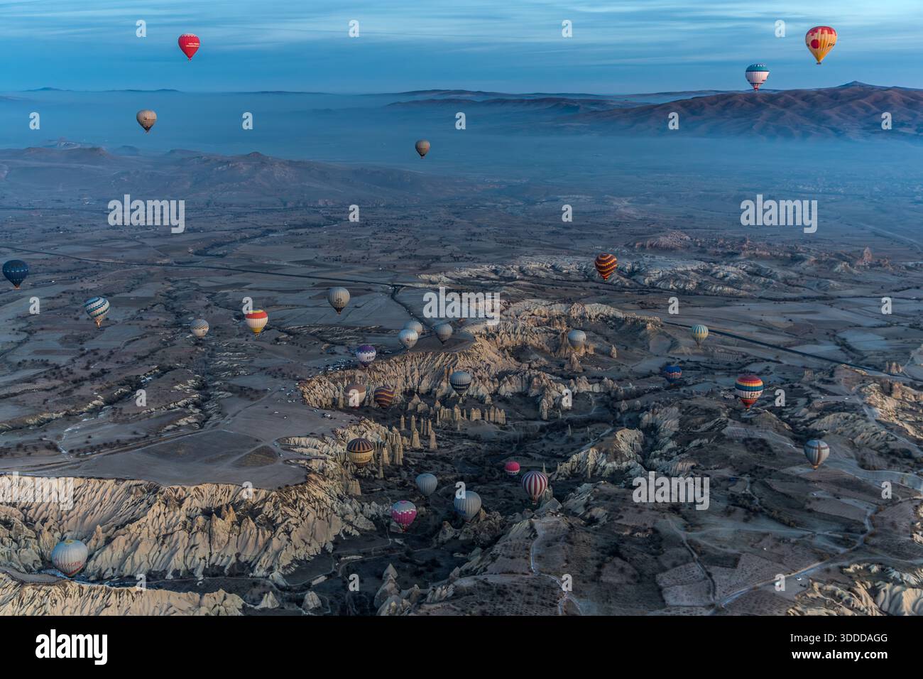 Hot air balloons float above the unique landscape of Göreme, Central Anatolia Region, Turkey Stock Photo