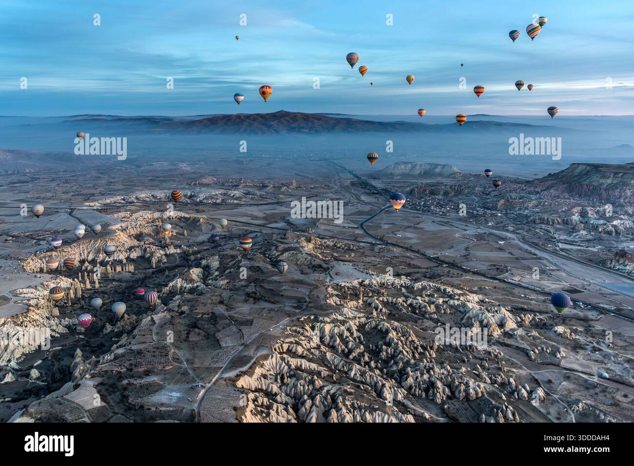 Hot air balloons float above the unique landscape of Göreme, Central Anatolia Region, Turkey Stock Photo