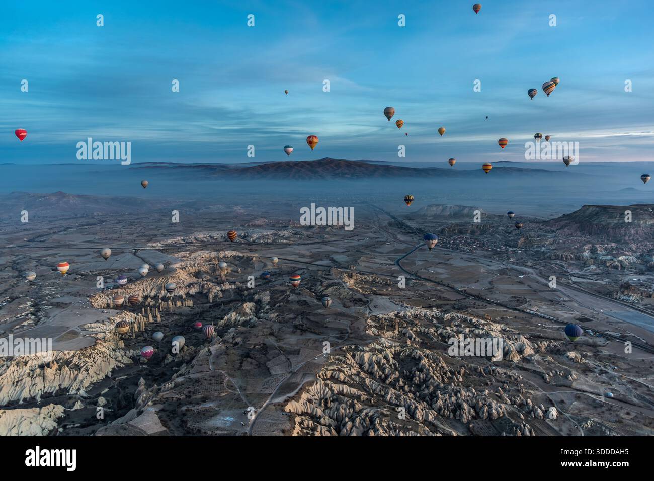 Hot air balloons float above the unique landscape of Göreme, Central Anatolia Region, Turkey Stock Photo