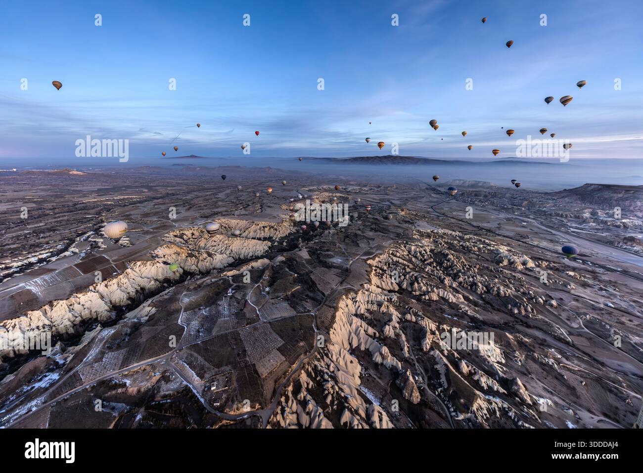 Hot air balloons float above the unique landscape of Göreme, Central Anatolia Region, Turkey Stock Photo